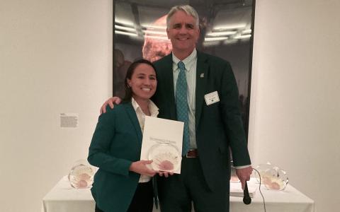 Rep. Sharice Davids accepting a Director’s Award for her support of The University of Kansas Cancer Center.