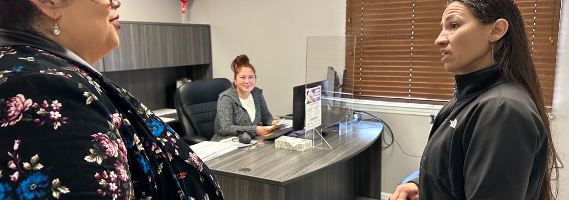 Davids with El Centro staff to learn about their efforts to enroll Kansans in affordable health care.