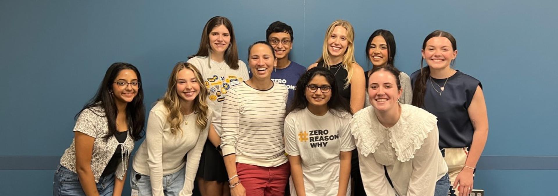 Rep. Sharice Davids with local teens after their conversation on mental health.