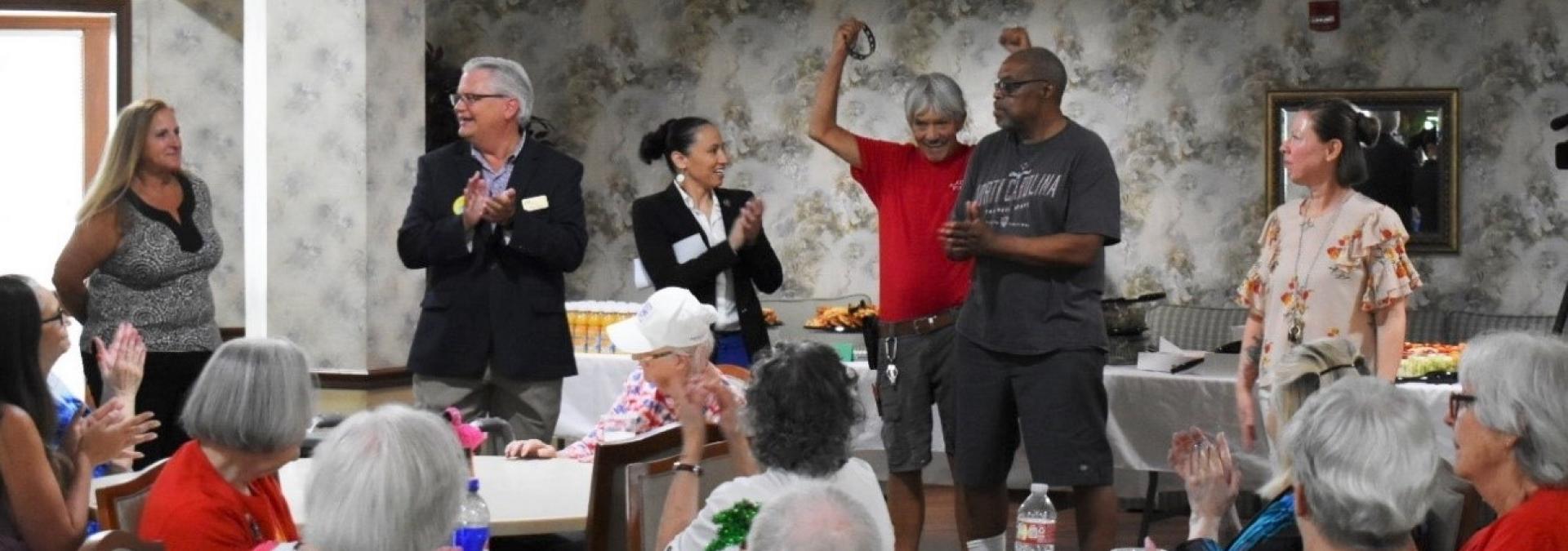 Rep. Sharice Davids with Kansas seniors celebrating new prescription drug savings