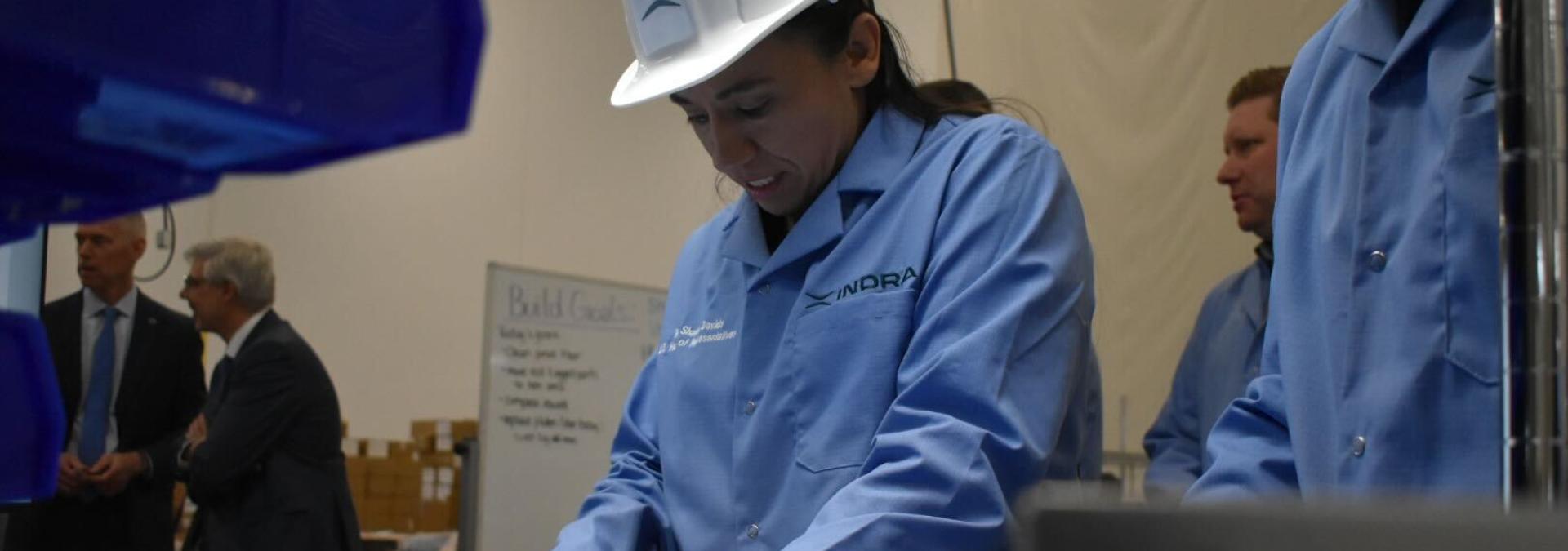 Rep. Davids working on a NextComm radio during her “Sharice’s Shift”