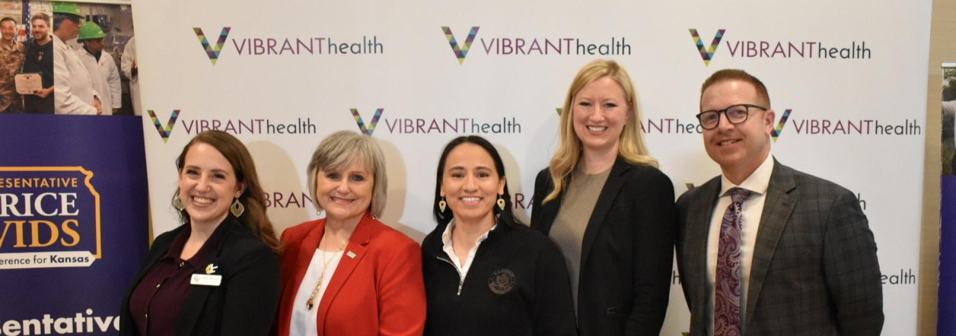 Rep. Sharice Davids and local health care leaders.