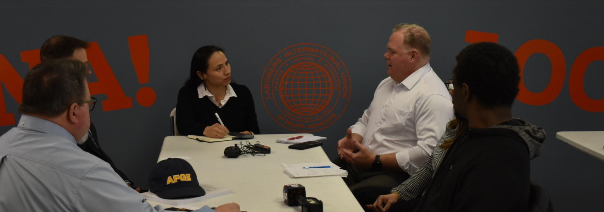 Rep. Sharice Davids speaks with former federal employees fired by DOGE