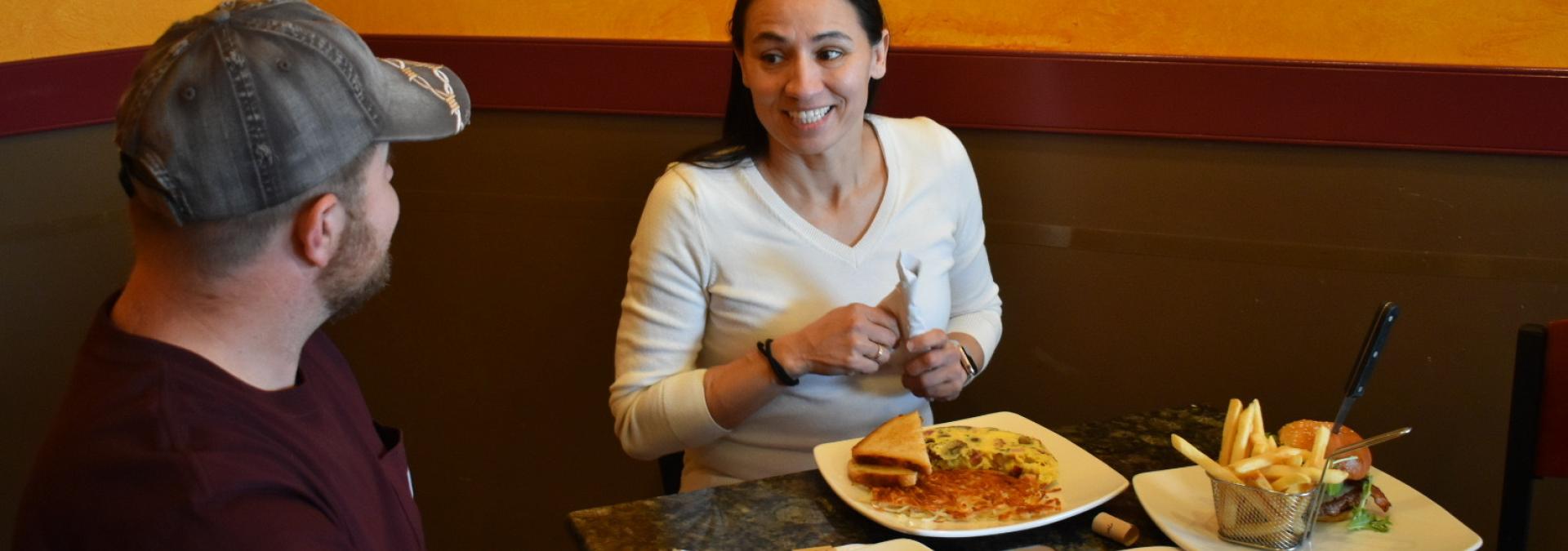 Representative Sharice Davids eating lunch at The Wooden Spoon.