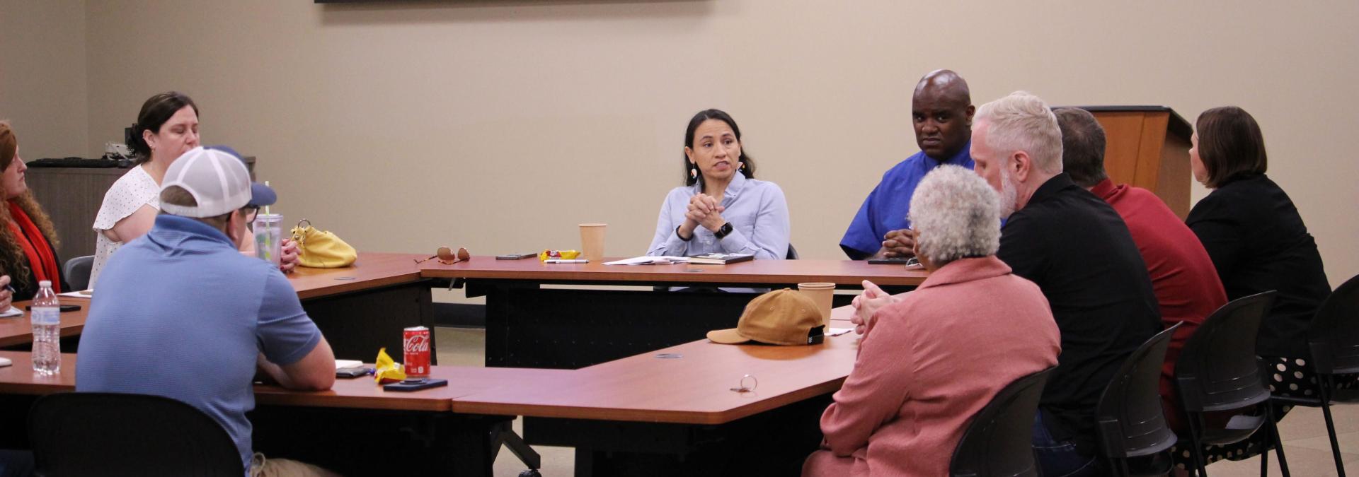Rep. Sharice Davids speaks with furloughed federal workers about her efforts to end the shutdown.