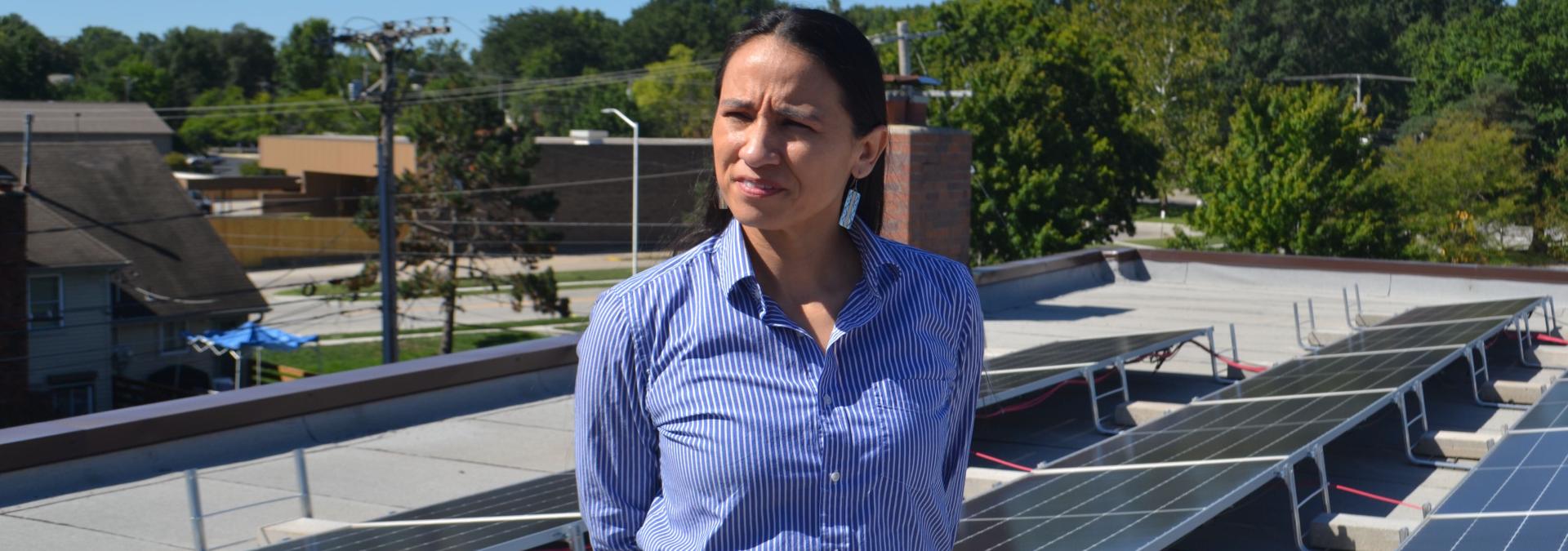 Rep. Sharice Davids with solar panels on the roof of FSC Inc., an engineering firm in Overland Park, KS.