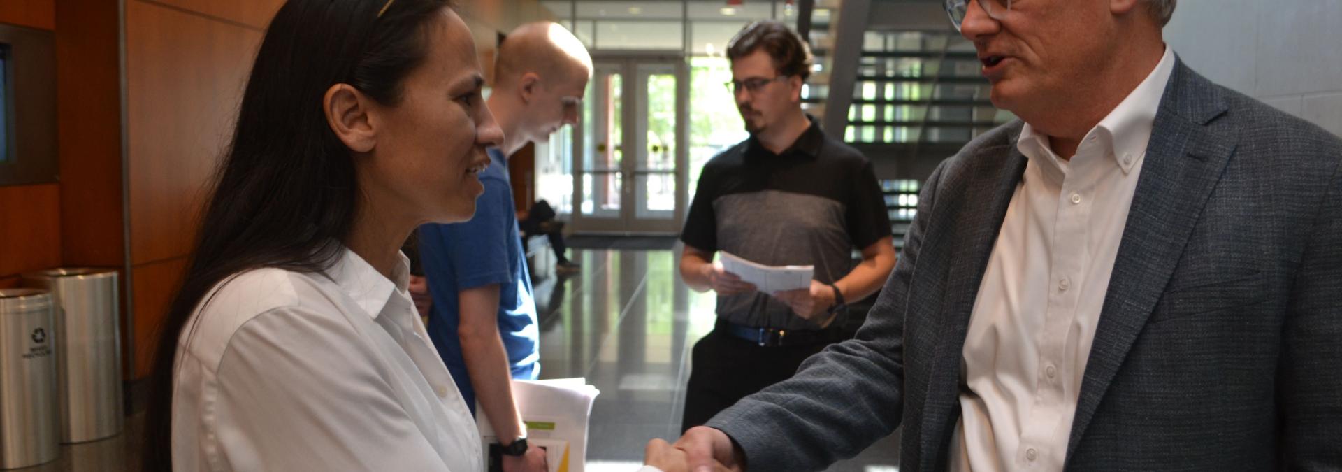 Representative Sharice Davids with former Yellow Corp. employee at JCCC’s job fair.