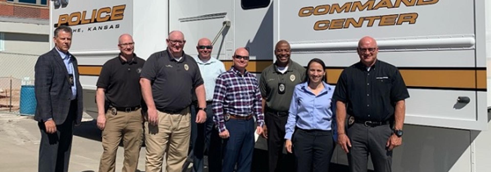 Rep. Davids with law enforcement officers at Olathe's mobile command unit