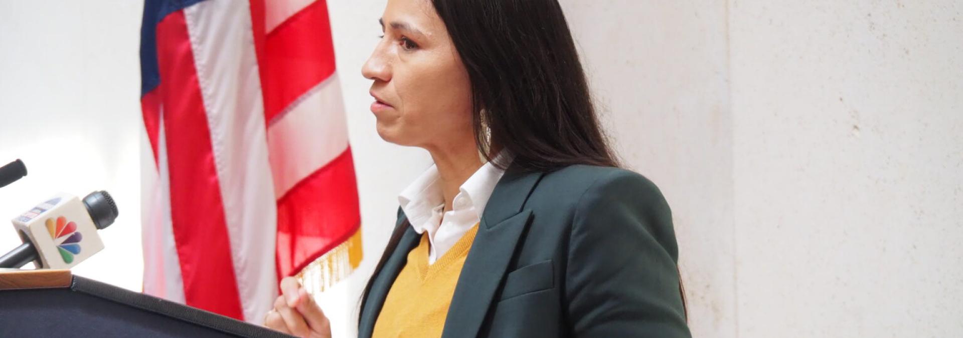 Rep. Sharice Davids at a podium giving a press conference. 