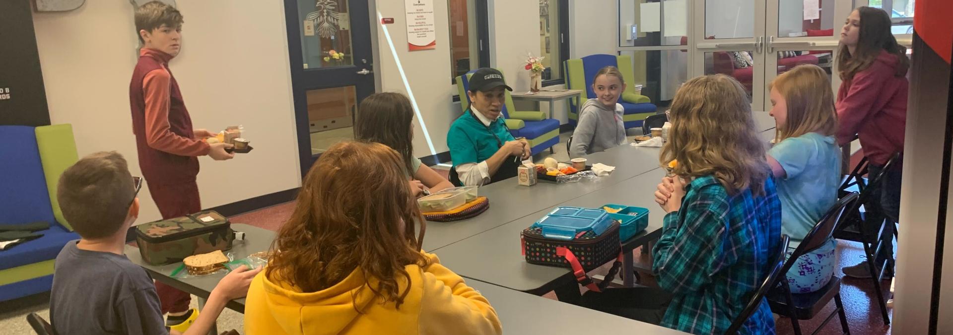 Rep. Sharice Davids eating lunch with Olathe Public Schools students.