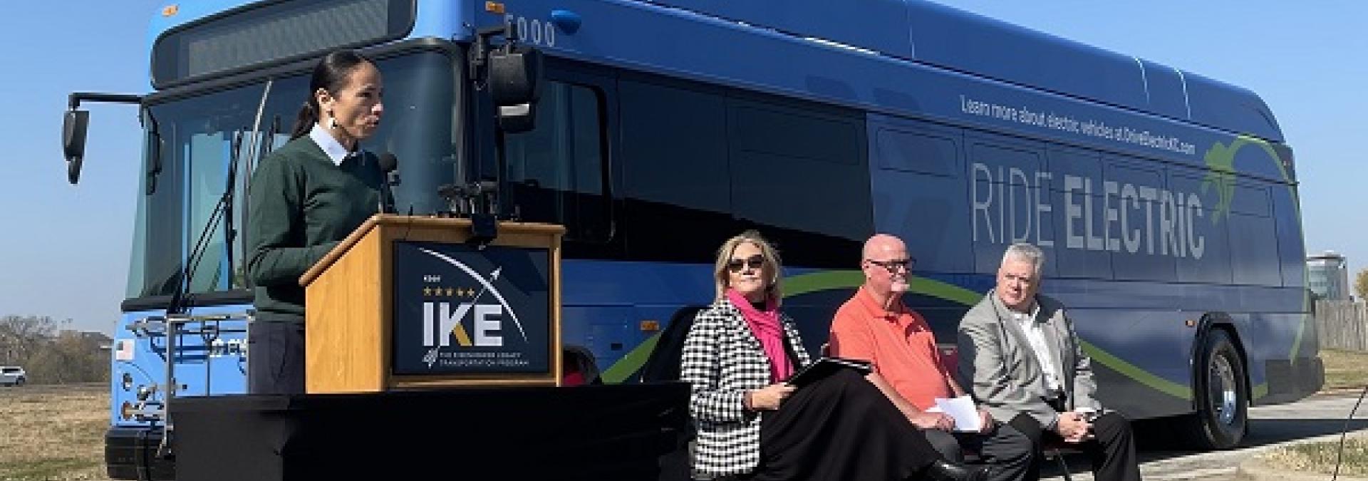 A picture of Rep. Davids in front of a KCATA electric bus.