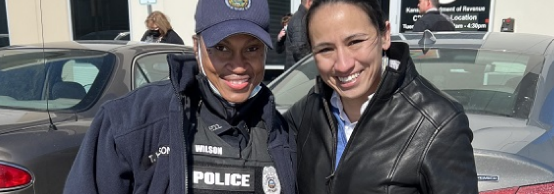 Rep. Sharice Davids with a local police officer at Johnson County Community College.