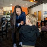 Rep. Davids interacting with a child