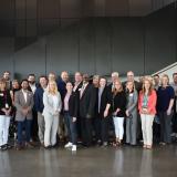 Rep. Sharice Davids with local officials celebrating the 15 projects receiving federal investments.