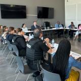 Rep. Sharice Davids speaking with local law enforcement, public health experts, and city officials during Mental Health Awareness Month.