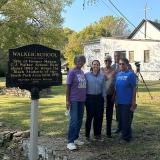 Representative Davids, Representative Cleaver, and the Webb family otuside of the former Walker School.