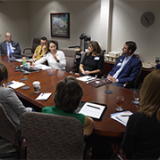 Rep. Sharice Davids and health care professionals at a roundtable event in Paola, Kansas.