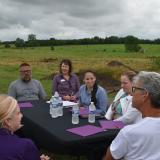 Rep. Sharice Davids at Courage Farms speaking with local producers.