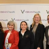 Rep. Sharice Davids and local health care leaders.