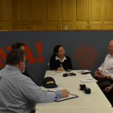 Rep. Sharice Davids speaks with former federal employees fired by DOGE