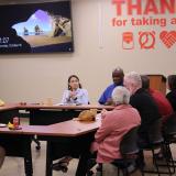 Rep. Sharice Davids speaks with furloughed federal workers about her efforts to end the shutdown.