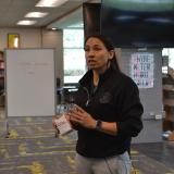 ep. Sharice Davids holding a box on Narcan, a common naloxone nasal spray used to reverse opioid overdoses.