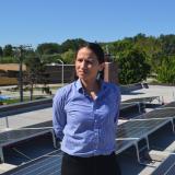 Rep. Sharice Davids with solar panels on the roof of FSC Inc., an engineering firm in Overland Park, KS.