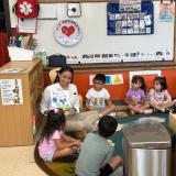 Rep. Sharice Davids reads to students at El Centro’s Head Start program.
