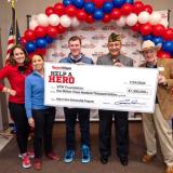 Rep. Sharice Davids joins Sport Clips Haircuts as they donate another $1.3 million to Help A Hero for veterans’ scholarships.