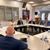 Rep. Sharice Davids and local education professionals at Shawnee Mission North High School.