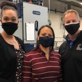 Three masked people looking at the camera