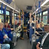 Group of people seated on a bus