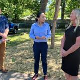 Rep. Sharice Davids with local officials after touring an Olathe lead pipe replacement site.