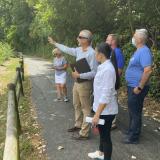 Group of people outdoors near fence