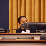 Sharice Davids masked behind a dais