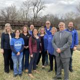 Sharice Davids standing outdoors with group of Merriam leaders