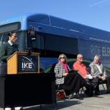 A picture of Rep. Davids in front of a KCATA electric bus.