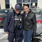 Rep. Sharice Davids with a local police officer at Johnson County Community College.