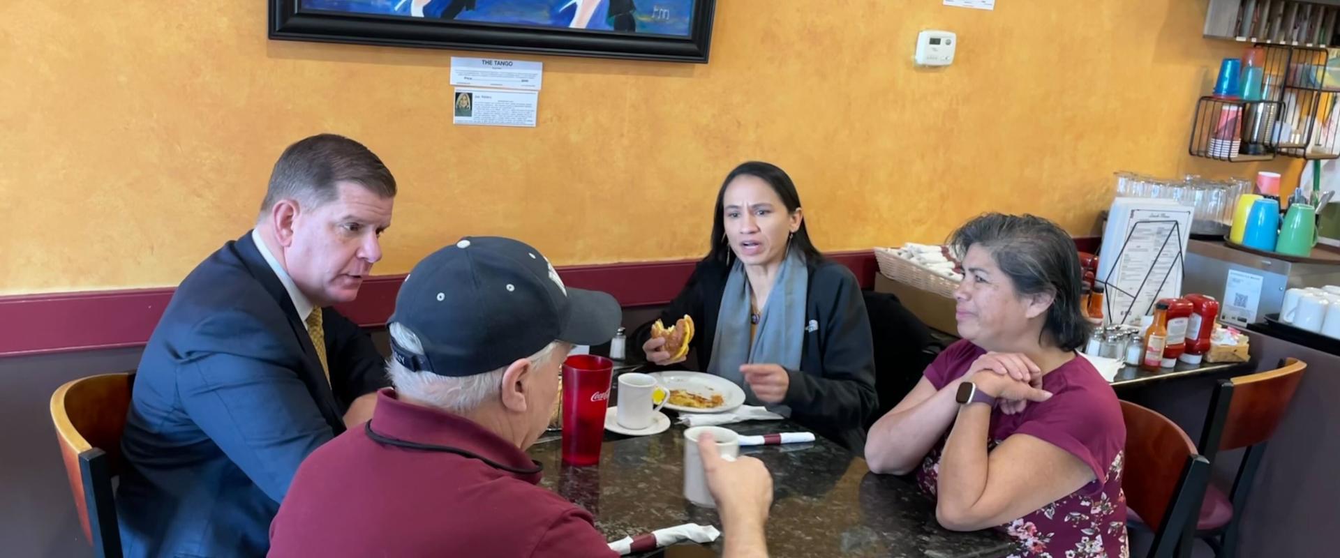 Sharice Davids and Labor Secretary Marty Walsh sitting in a restaurant