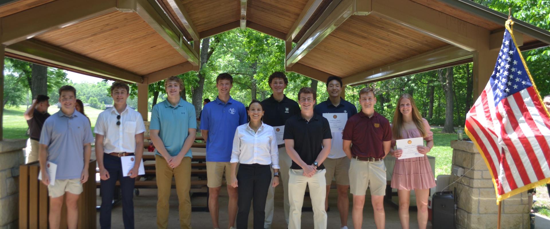 Rep. Sharice Davids stands with a group of service academy students