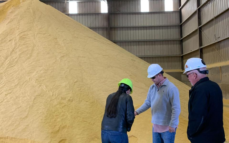Rep. Davids, Bill Pracht, and Greg Krissek discuss crops produced by local farmers that are converted to ethanol.