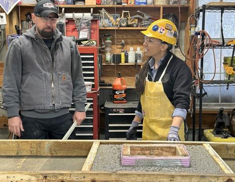 Rep. Davids laying concrete