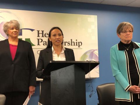 Kansas Deputy Medicaid Director Christine Osterlund, U.S. Representative Sharice Davids, and Kansas Governor Laura Kelly speaking at a press conference earlier today.
