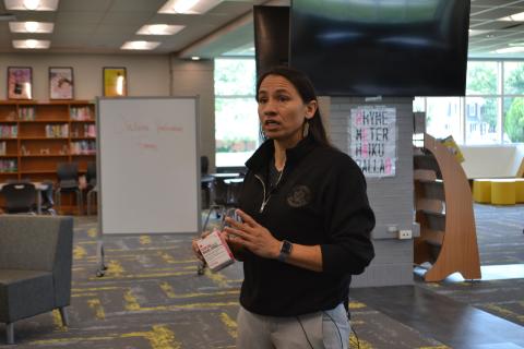 ep. Sharice Davids holding a box on Narcan, a common naloxone nasal spray used to reverse opioid overdoses.