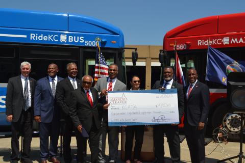 Representative Davids and Cleaver present a check to the KCATA team.