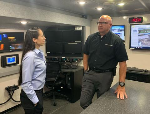 Rep. Davids at the Olathe police mobile command unit.