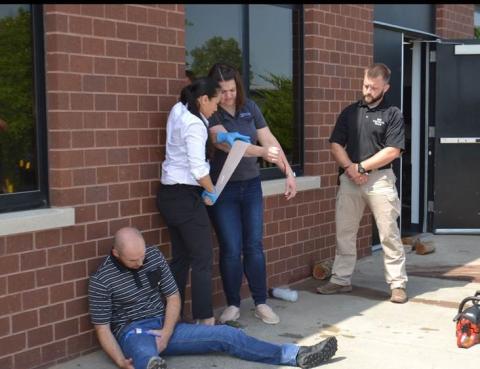 Representative Sharice Davids applies a tourniquet while at the Johnson County Regional Police Academy.