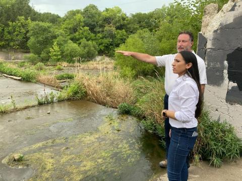 Rep. Sharice Davids with Rob Beilfuss, Stormwater Manager for the City of Olathe, at the Cedar Lake Dam restoration project site.