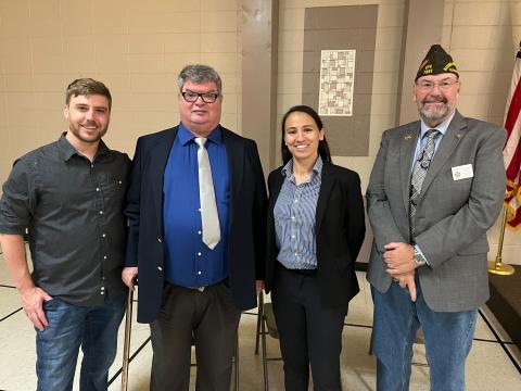 Representative Sharice Davids with Kyle Prellberg, Kansas U.S. Army veteran, Jim Bunker, Disabled American Veterans, and Bruce Fischbach, Kansas Veterans of Foreign Wars.