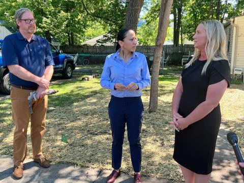 Rep. Sharice Davids with local officials after touring an Olathe lead pipe replacement site.